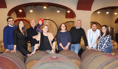 The family in the barrel room at Colli di Castelfranci in Campania, Italy