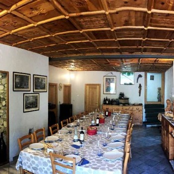 winemaker dinner setup at Folini Winery with beautiful hand carved ceiling detail