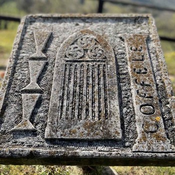 A weathered stone tablet showing the Coffele brand.