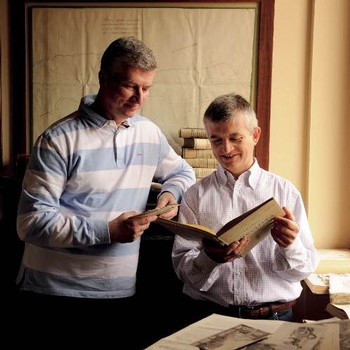 winemakers reading through historical books at La Tosa